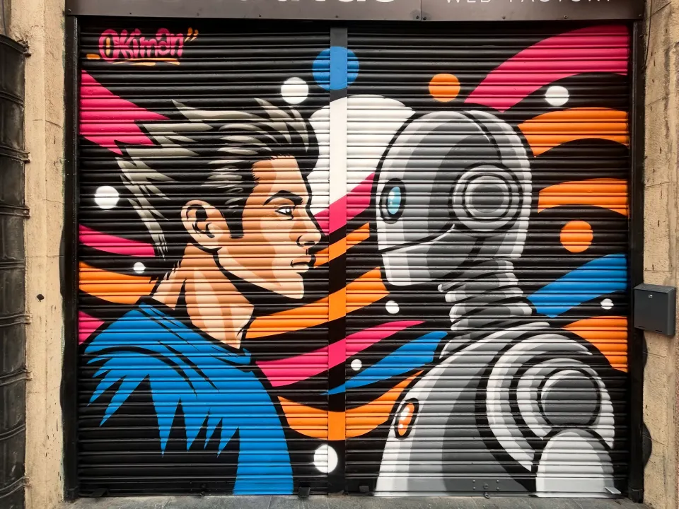 Persiana de Idenautas pintada con un chico y un robot cara a cara, en negro, naranja, rosa y azul